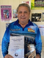 Image of man holding certificate